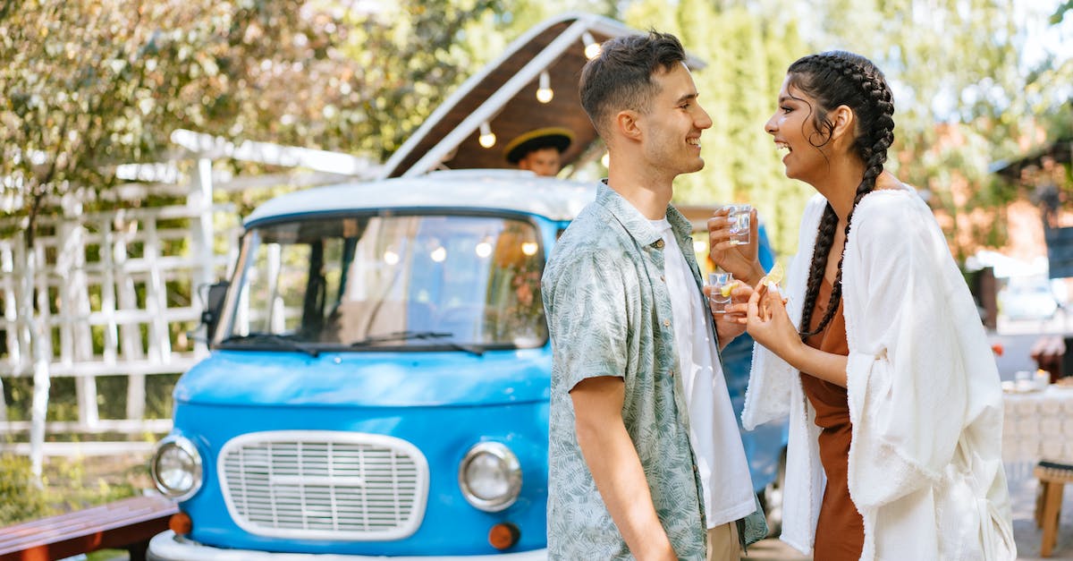 Where do I find a car in DayZ? - Man in Blue Button Up Shirt Standing Beside Woman in White Shirt