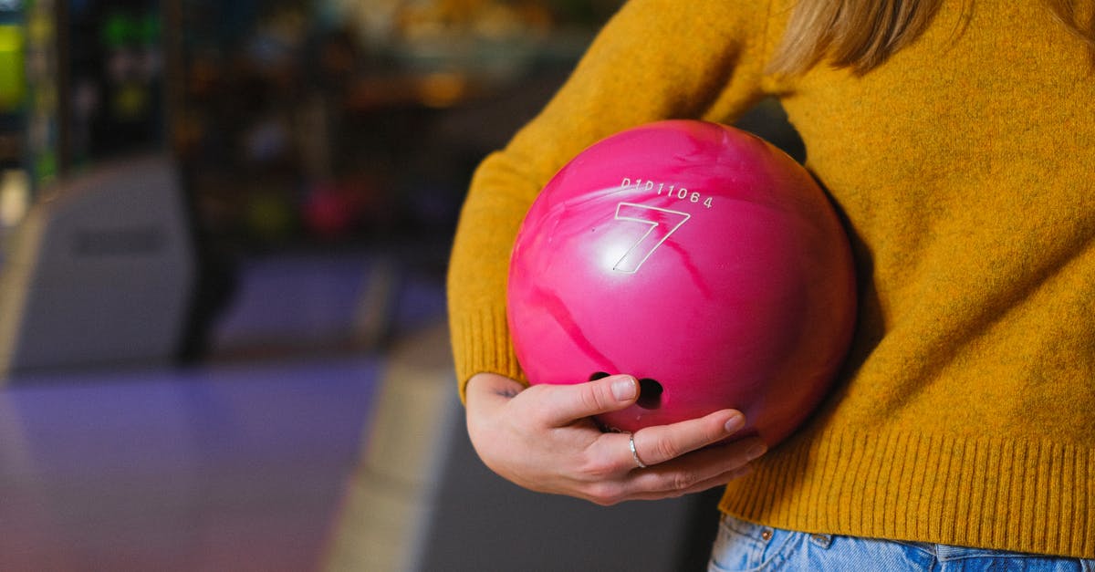 Where do I find bobbleheads, after benching the bobblehead stand? - Woman in Yellow Long Sleeve Shirt Holding Pink Heart Balloon