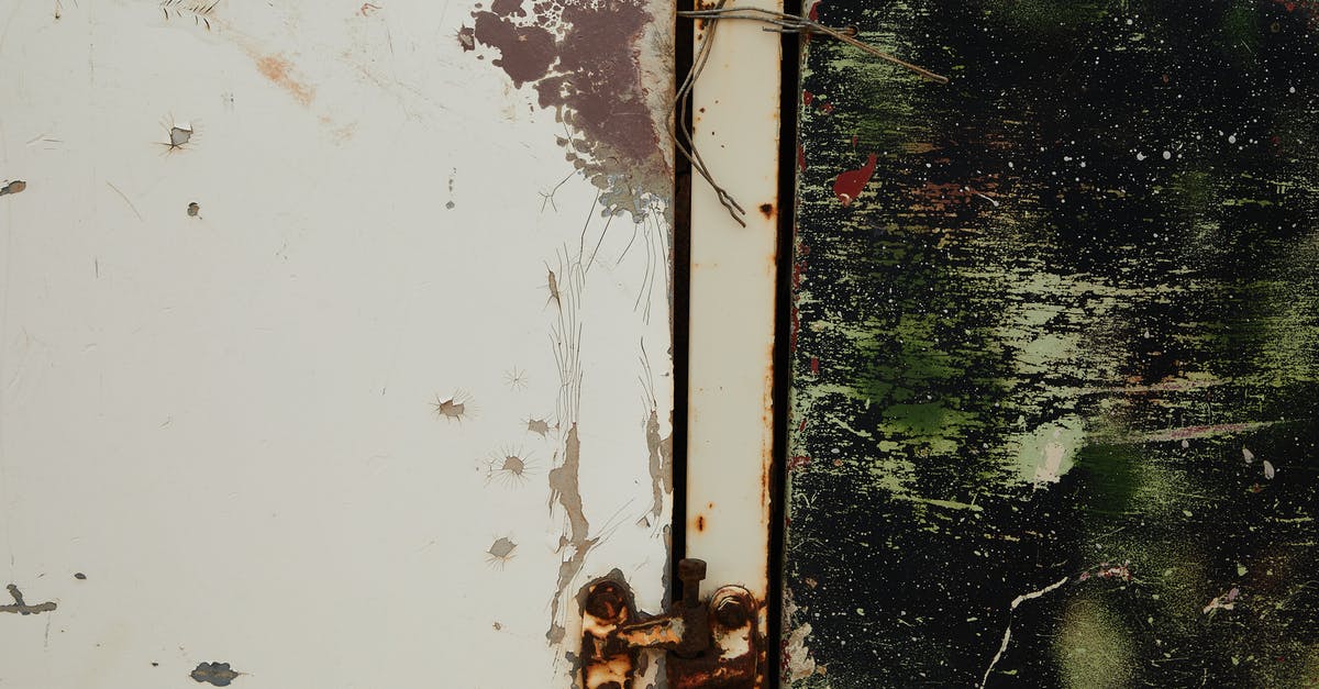 Where do I go after finding the broken communications wire? - Old shabby metal door with rusty hinge near green wall Where do I go after finding the broken communications wire? - Old shabby metal door with rusty hinge near green wall