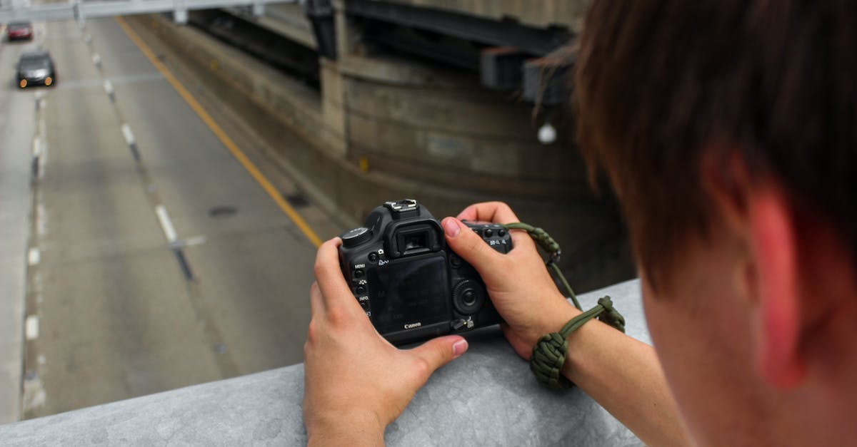 Where do I take vehicles that Simeon has asked for? - Person Holding Dslr Camera