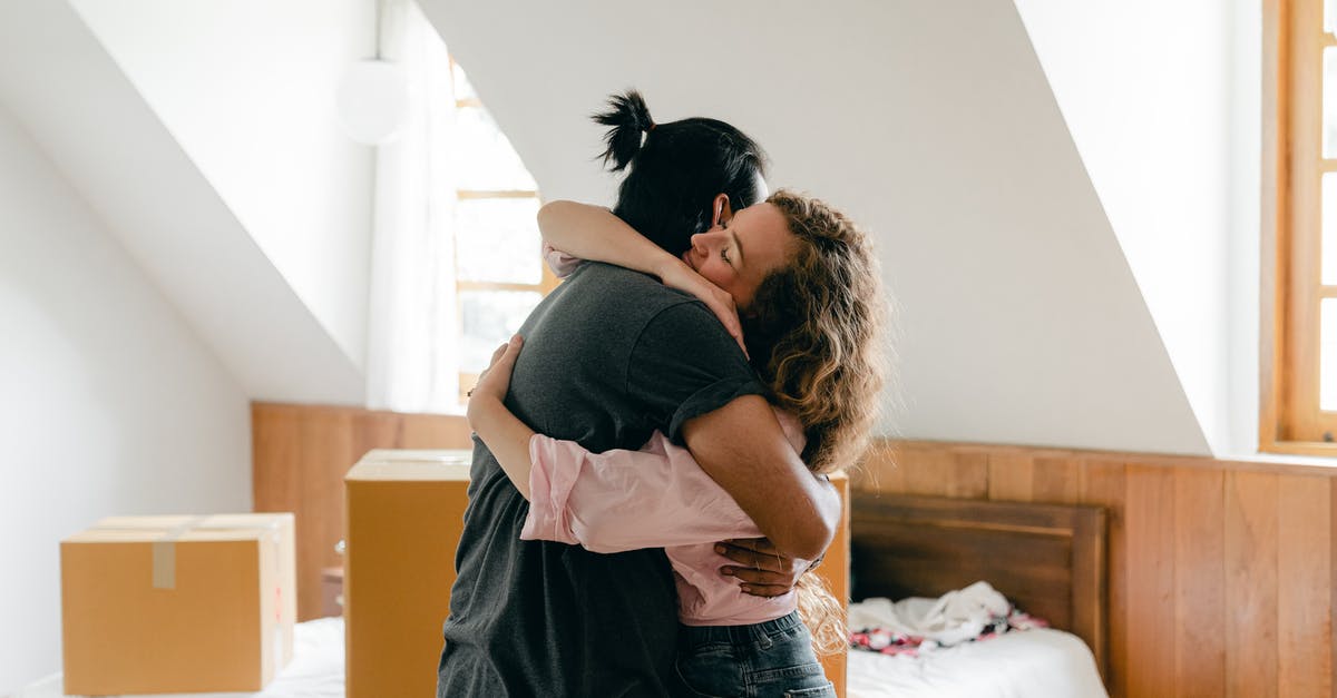 Where does the flat world start to corrupt? - Happy couple hugging after moving in new apartment