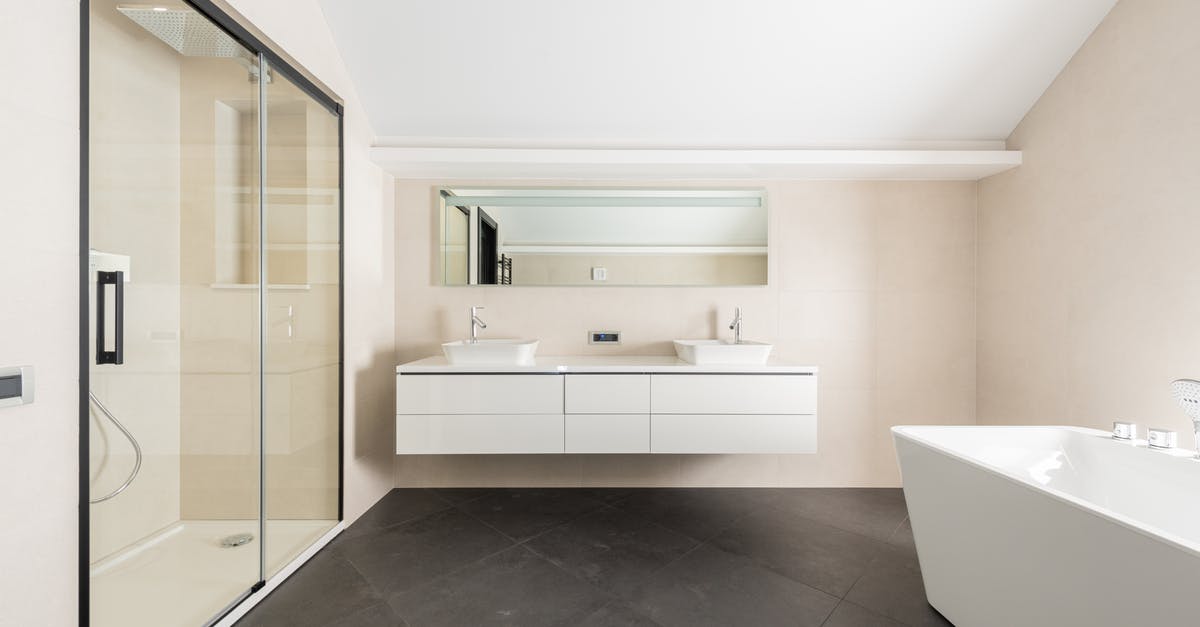 Where does the new tile appear in Threes? - Interior of spacious modern bathroom with shower cabin bathtub and minimalist furniture in contemporary apartment Where does the new tile appear in Threes? - Interior of spacious modern bathroom with shower cabin bathtub and minimalist furniture in contemporary apartment