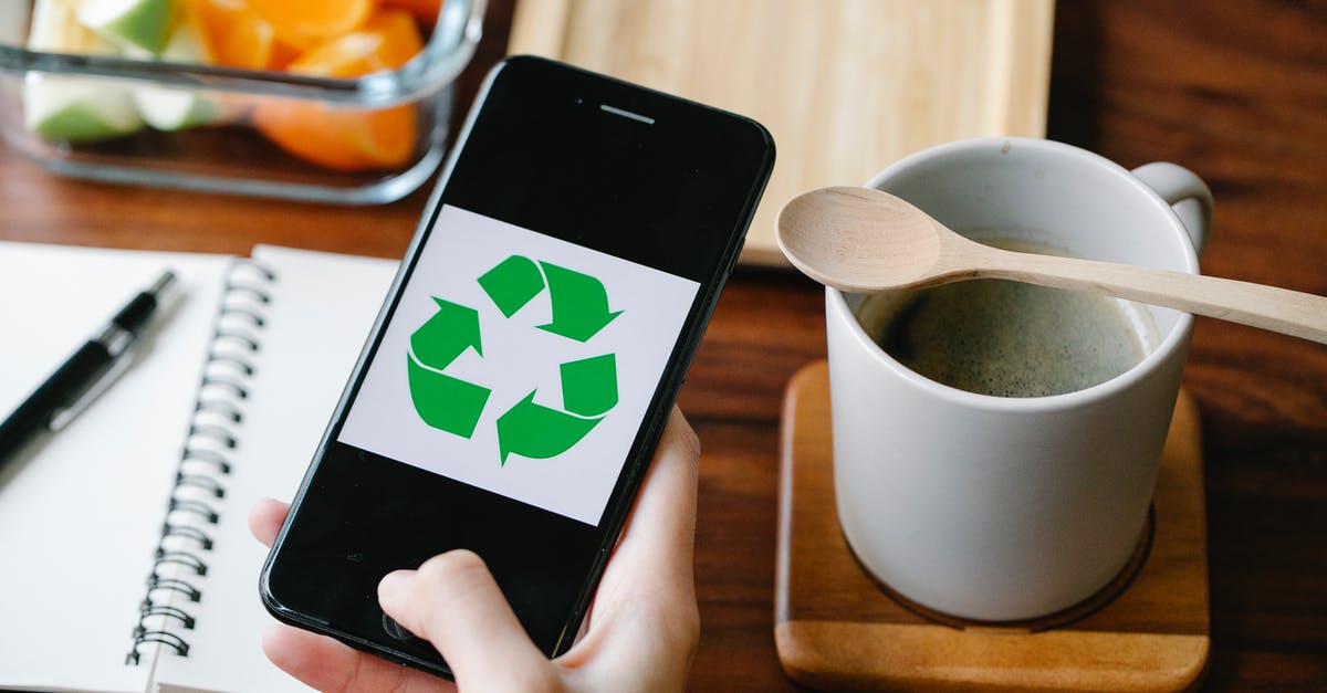 Where does this symbol come from? Or is it just a show? Or how is it related to the game? - Crop person using recycling app on smartphone against coffee Where does this symbol come from? Or is it just a show? Or how is it related to the game? - Crop person using recycling app on smartphone against coffee