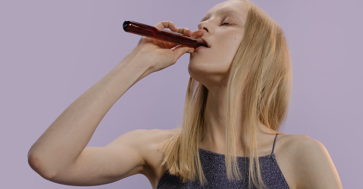 Where exactly do my blood echoes go when I die? - Woman in Black Tank Top Holding Brown Hair Brush