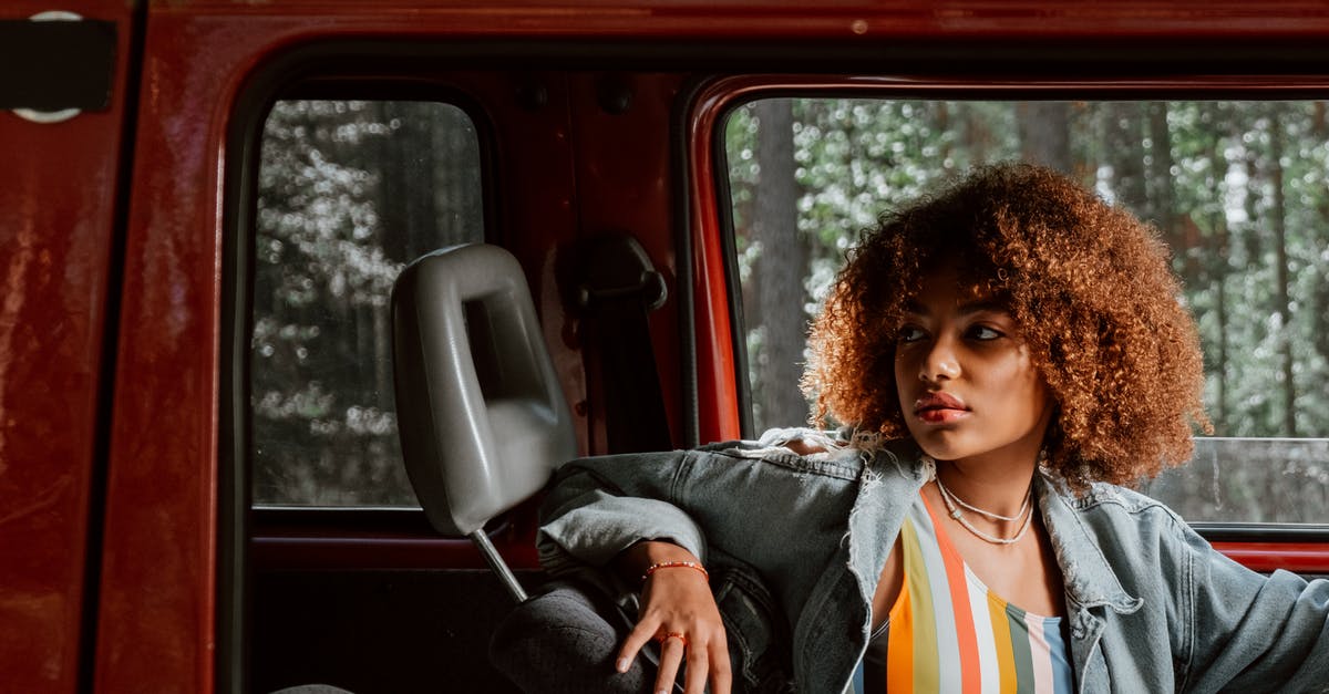 Where has my car gone? - Woman in Black Jacket Sitting on Car Seat