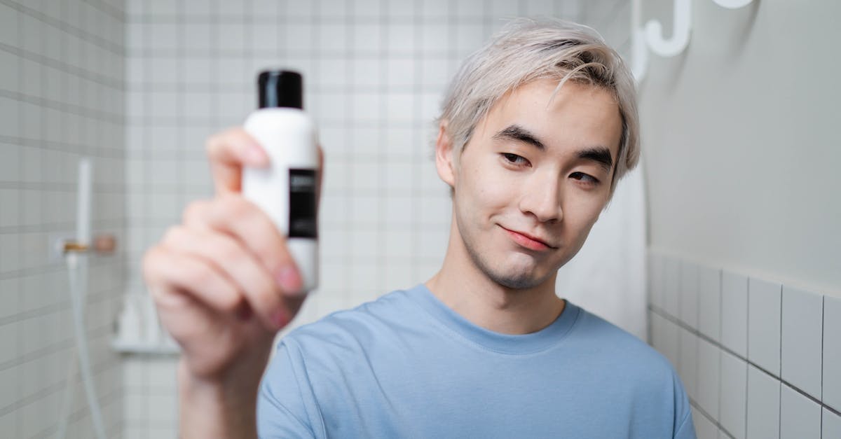 Where is a good location to unlock the faster health regeneration perk? - Man in Blue Crew Neck Shirt Holding White and Black Bottle