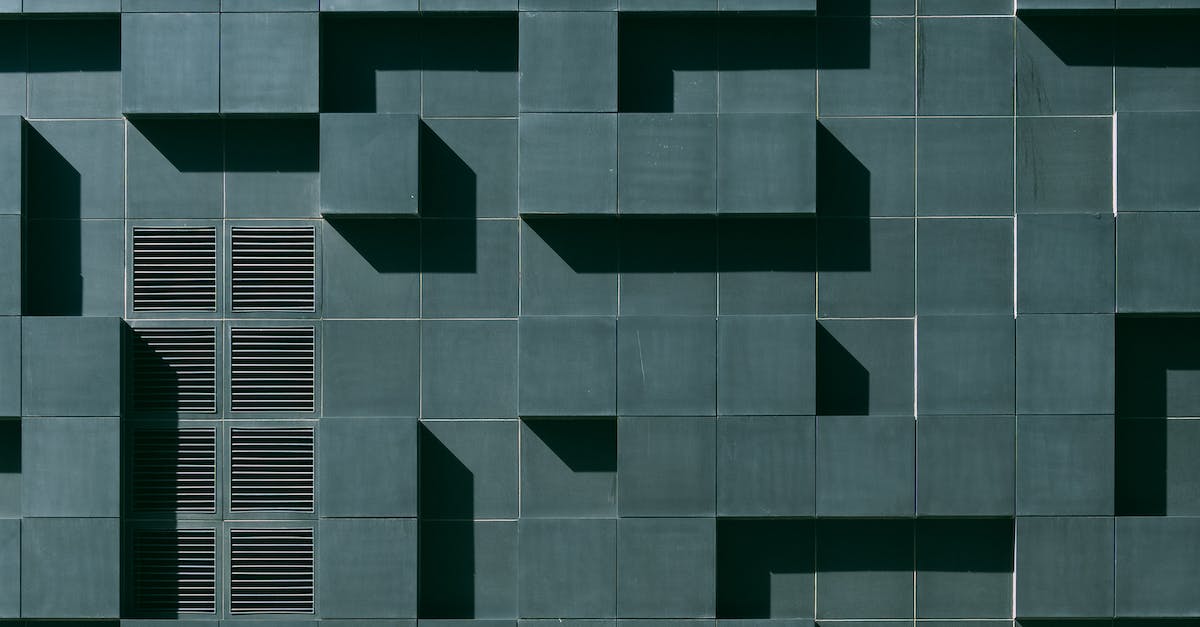 Where is Dreadjudge's Illusion 3? - Gray Concrete Building Exterior With Geometric Design Where is Dreadjudge's Illusion 3? - Gray Concrete Building Exterior With Geometric Design