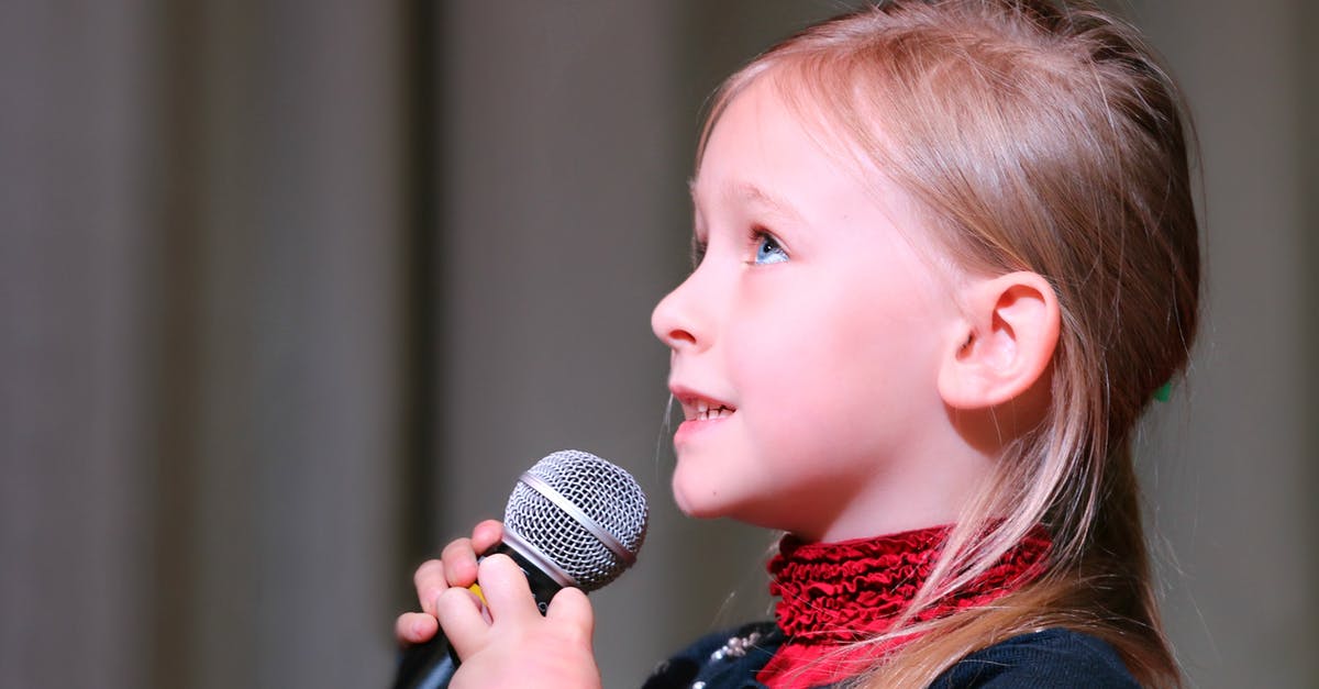 Where is Eluned in the final stages of Song of the Elves? - Girl Holding Black Dynamic Microphone While Looking Above Where is Eluned in the final stages of Song of the Elves? - Girl Holding Black Dynamic Microphone While Looking Above