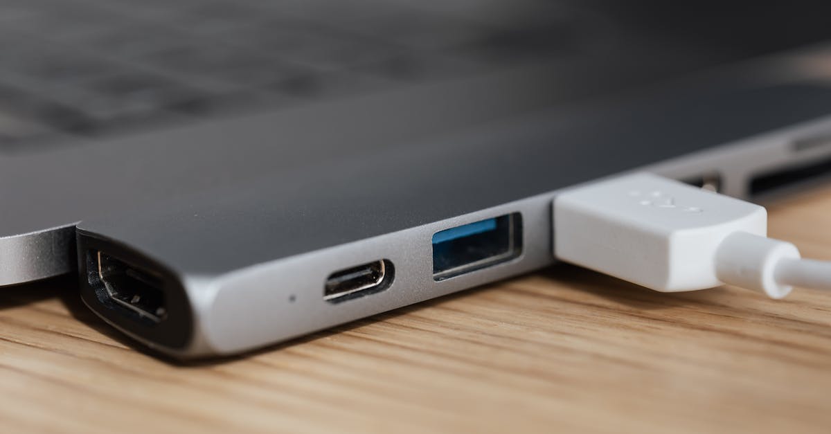 Where is Link at with Ilia in this screenshot? - USB type c multiport adapter with plugged white cable connected to modern laptop