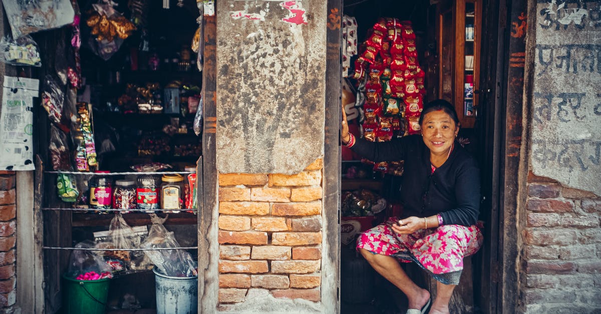 Where is Majni's merchant chest? - Middle-aged Woman sitting on her Store 