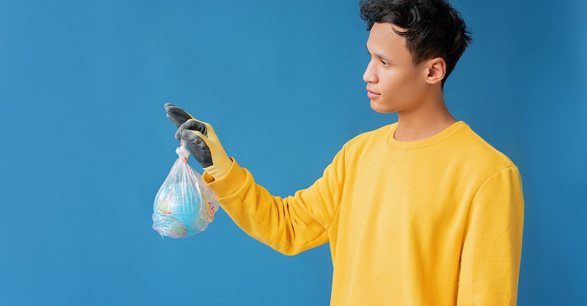 Where is my Minecraft world saved? [duplicate] - A Man Holding a Globe in the Plastic