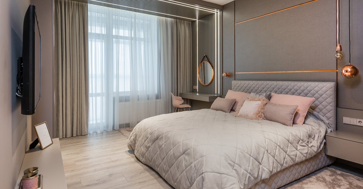 Where is the bed you rent in vault 21? - Stylish bedroom interior with comfortable bed and vanity table Where is the bed you rent in vault 21? - Stylish bedroom interior with comfortable bed and vanity table
