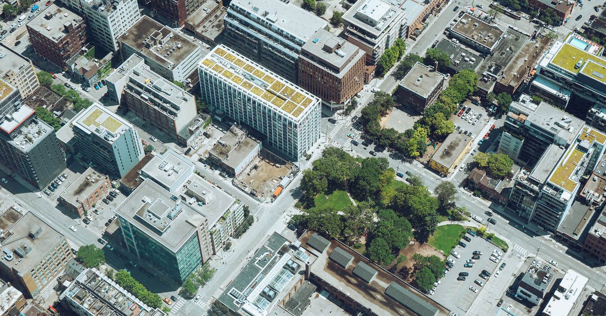 Where is the Iron Golem Spawning area HEIGHT centered? - Drone view modern city area with contemporary apartment buildings and landscaped public territories on sunny day