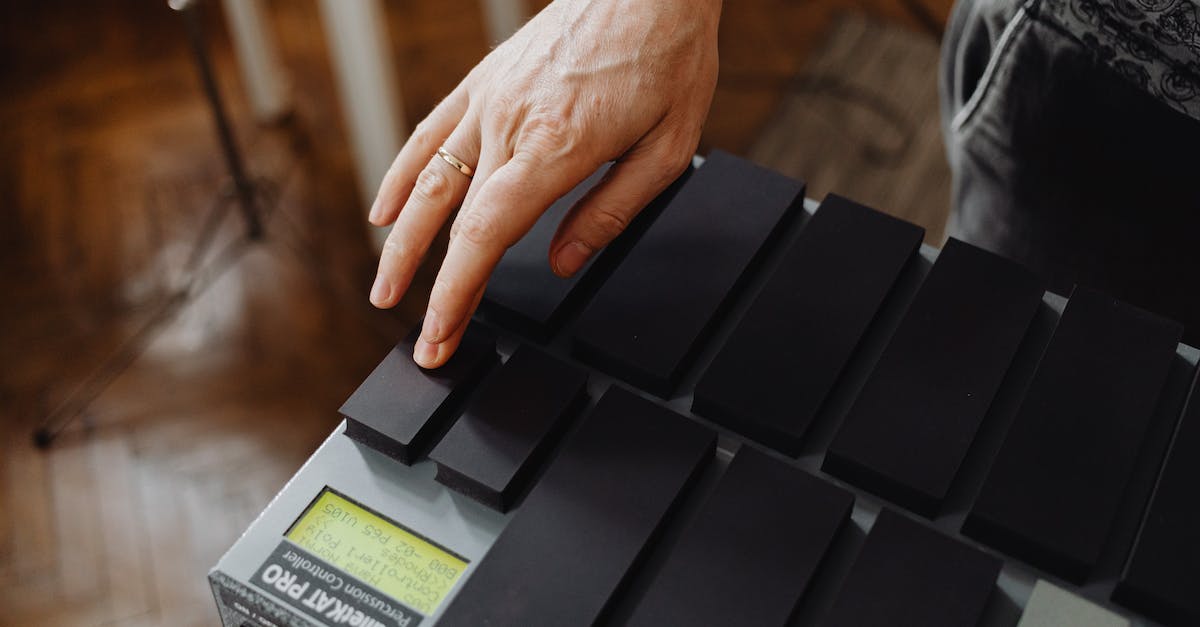 Where is the key to the Chest of the Source King? - Person Holding Black and Gray Electronic Device