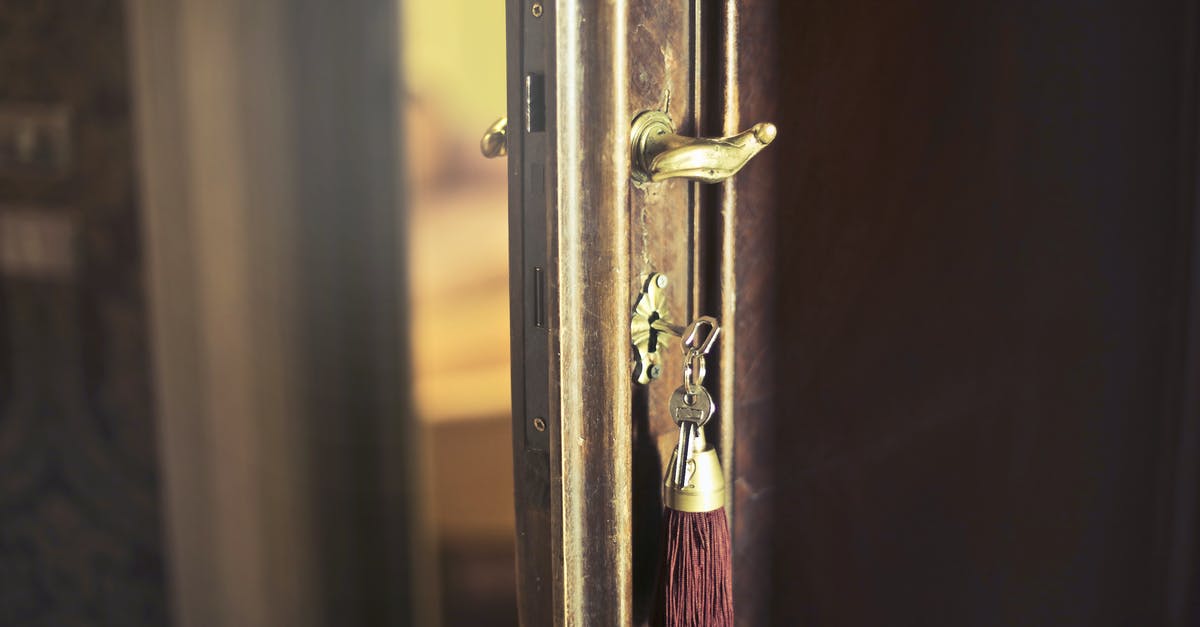 Where is the key to the guarded door? - Key with trinket in shabby door