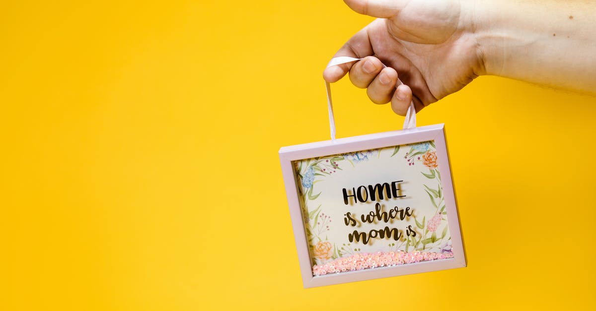 Where is the Kraken? - A Person Holding a Picture Frame with a Floral Design Where is the Kraken? - A Person Holding a Picture Frame with a Floral Design