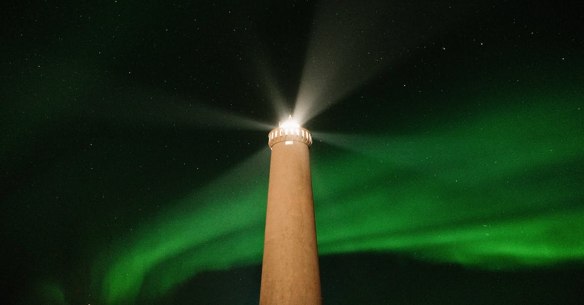 Where is the last green star in the Clockwork Ruins Galaxy? - From below of high lighthouse tower burning in dark night against black sky with glowing green aurora light in north