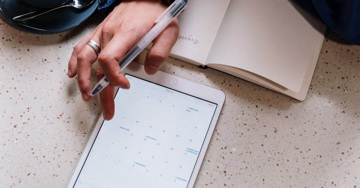 Where is the program scheduler on the iPad version? - Person Holding Pen and Using a Tablet Where is the program scheduler on the iPad version? - Person Holding Pen and Using a Tablet