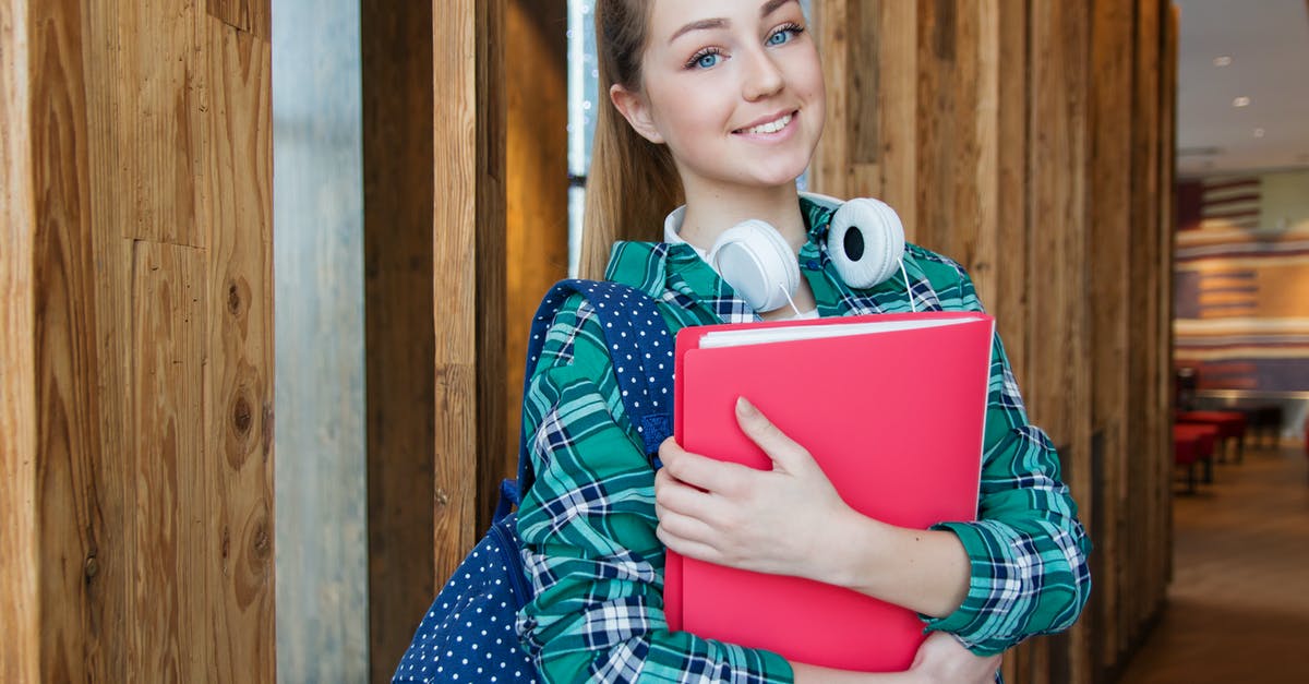 Where is the shader packs folder on Mac? - Woman Standing in Hallway While Holding Book