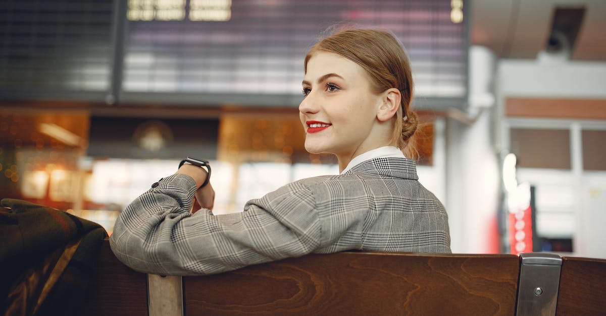 Where is the the Great Hall Treasury Chest for spoils of the assigned adventures? - Side view of positive female manager waiting for flight on wooden seat in airport