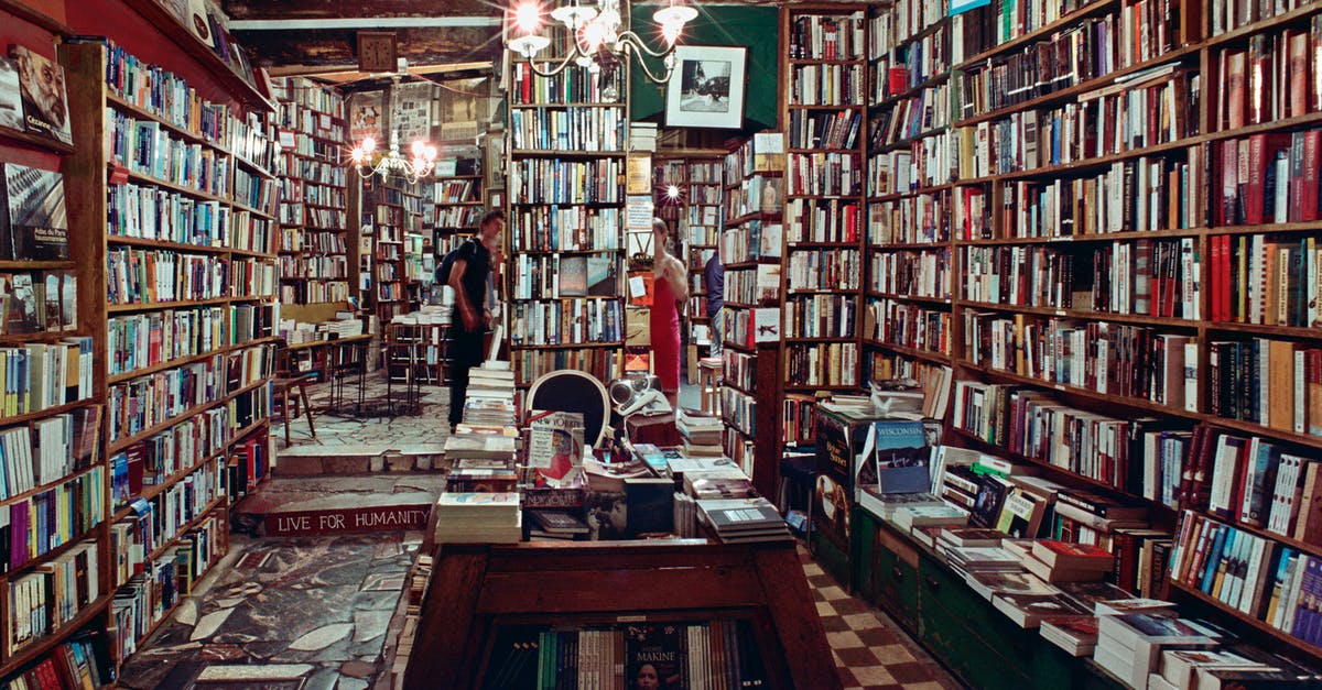 Where should I return all of my overdue library books? - Books on Brown Wooden Shelf