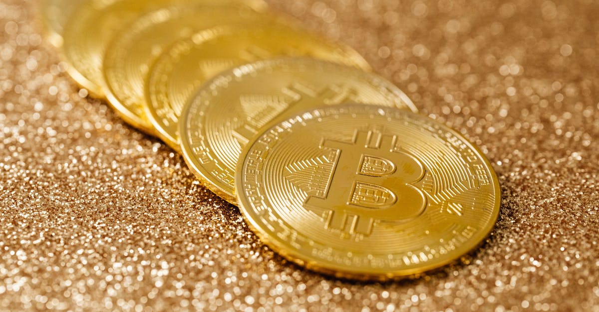 Where the gold at? - Gold Round Coin on Brown Textile