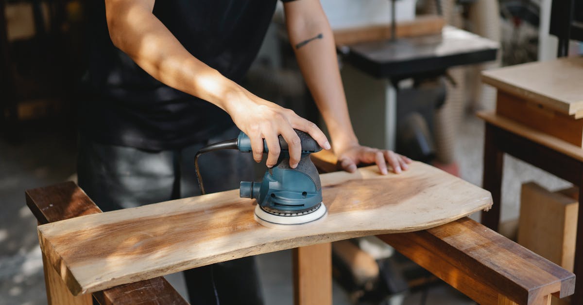 Where to grind for complete decks? - Craftsman polishing wooden board with grinding instrument Where to grind for complete decks? - Craftsman polishing wooden board with grinding instrument