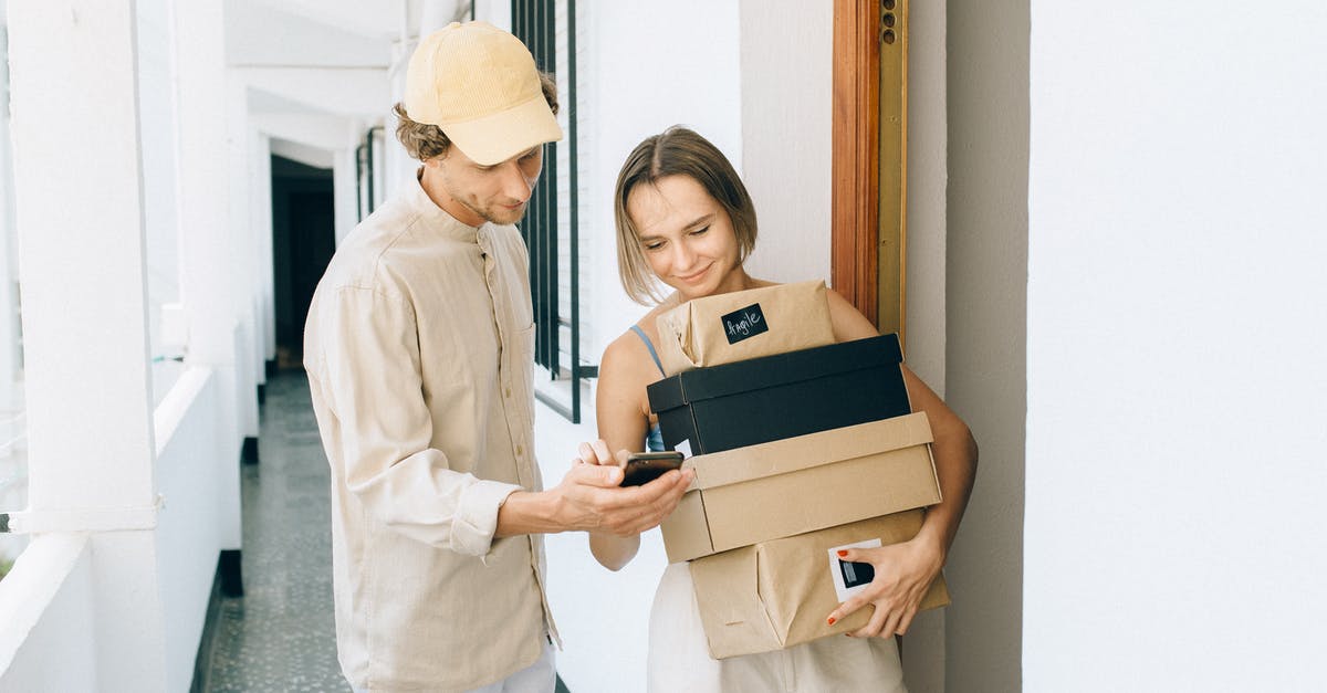Where to obtain orders for First Prepper deliveries? - A Woman Receiving Her Parcels while Standing Beside the Delivery Man