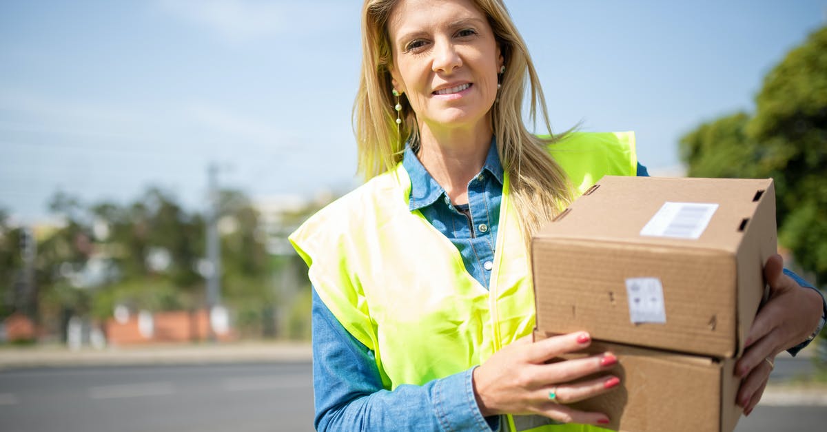 Where to obtain orders for First Prepper deliveries? - Close-Up Shot of a Deliverywoman Holding Delivery Boxes Where to obtain orders for First Prepper deliveries? - Close-Up Shot of a Deliverywoman Holding Delivery Boxes