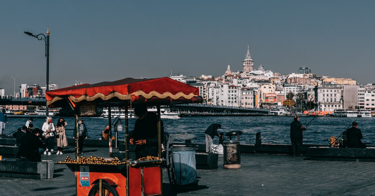Where/When can I find Xur in Destiny tower and what does he sell? [duplicate] - Red food truck located on crowded quay near sea against coastal city with buildings and Galata tower in Istanbul in Turkey