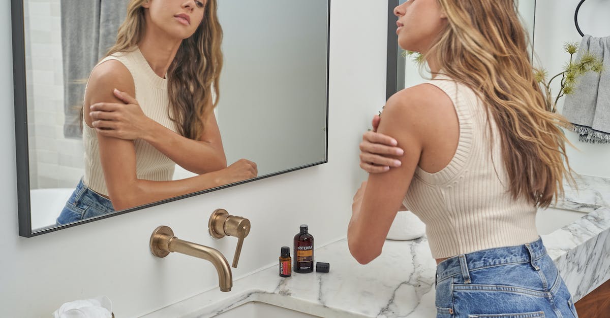 Which blade oil should I use against the Wild Hunt? - A Woman in White Tank Top Standing in Front of the Mirror