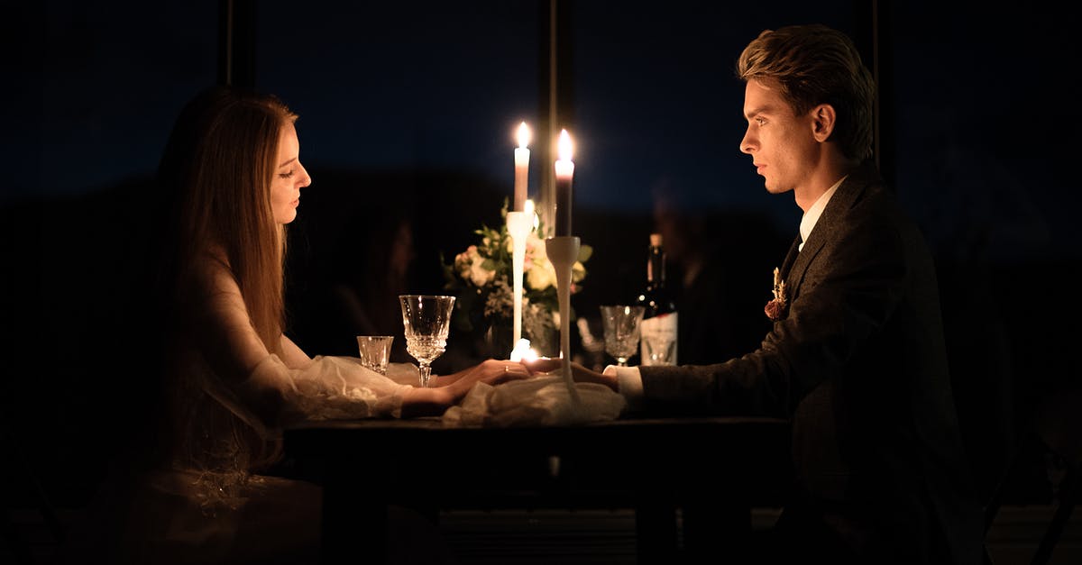 Which Dark Events take priority over others? - Young elegant couple holding hands during romantic dinner in restaurant