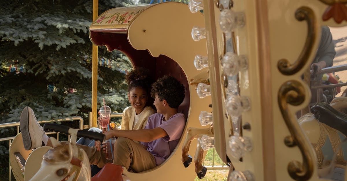 Which date in 1999 was "Action Half-Life" first released? - Teenage couple sitting in carousel seat smiling and talking to each other Which date in 1999 was "Action Half-Life" first released? - Teenage couple sitting in carousel seat smiling and talking to each other