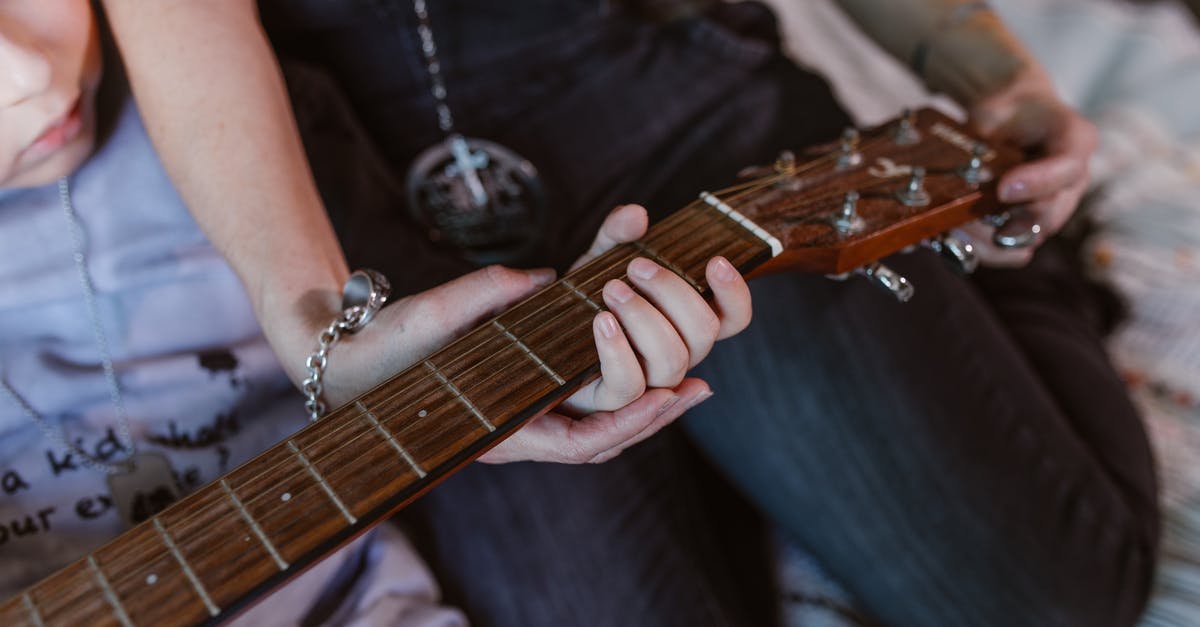 Which gun does the Double Duty talent affect? - Anonymous young mother with little son practicing on guitar at home Which gun does the Double Duty talent affect? - Anonymous young mother with little son practicing on guitar at home