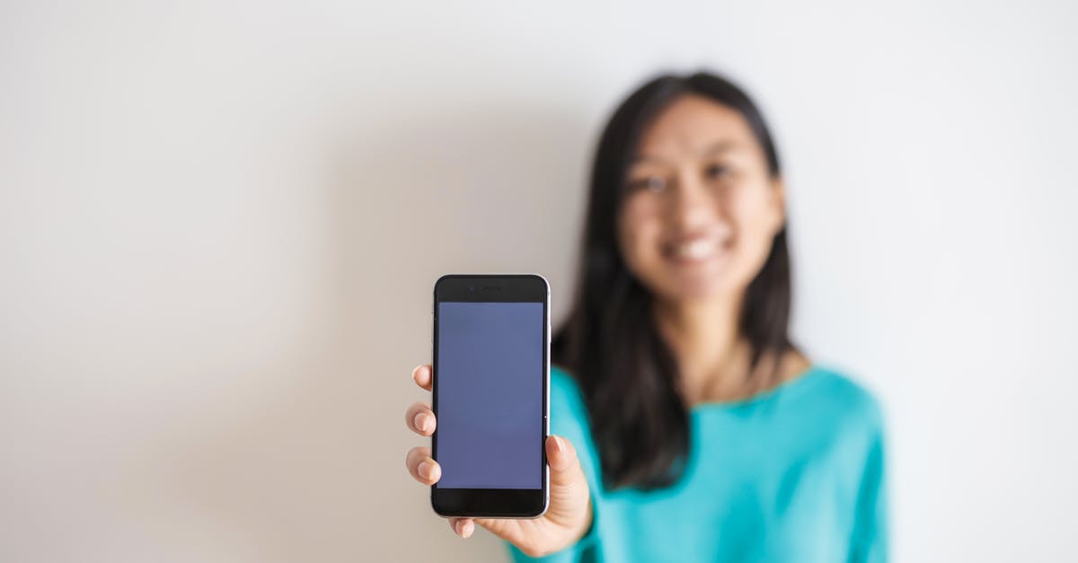 Which hand should you hold your phone in when playing Just Dance Now? - Photo of Person Holding Mobile Phone Which hand should you hold your phone in when playing Just Dance Now? - Photo of Person Holding Mobile Phone