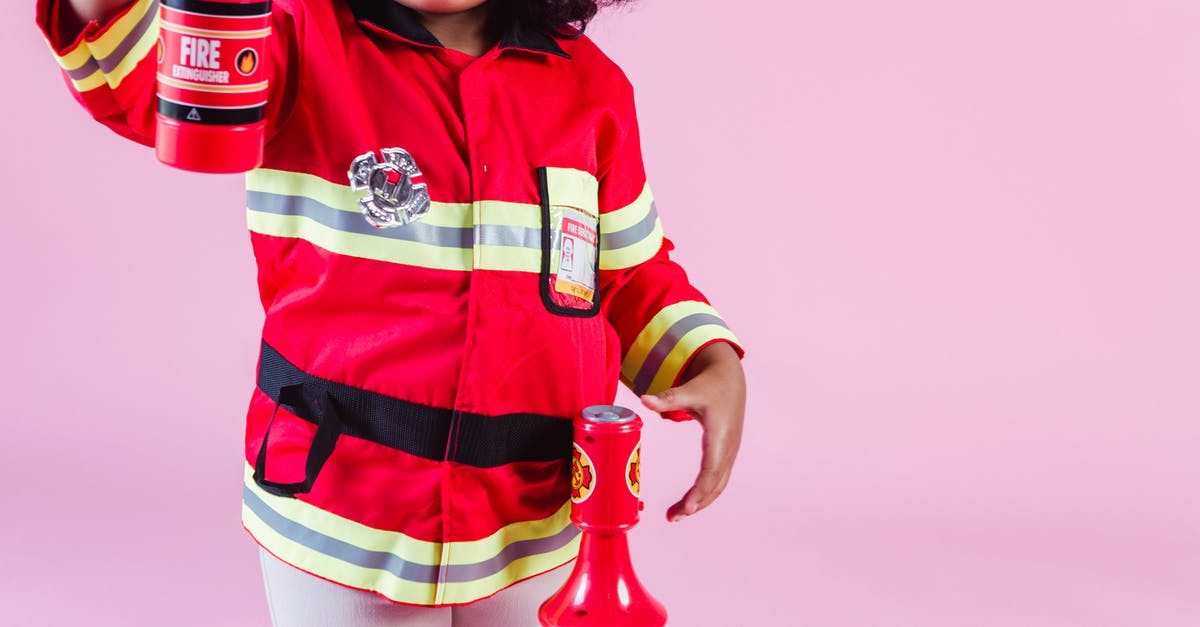 Which hero gets a "Game Won" in the statistics if I switch heroes mid-game? - Crop anonymous little ethnic kid in fireman costume with fake fire extinguisher and megaphone standing on pink background