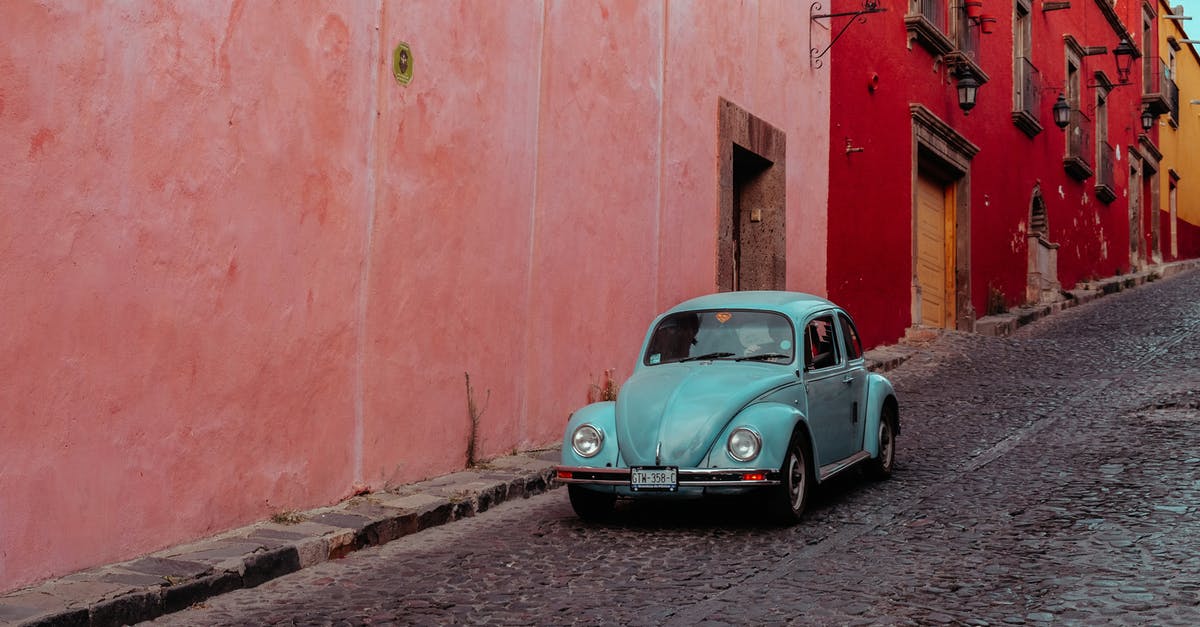 Which heroes move the fastest along the ground? - Turquoise Buggy Moving Along Street with Pink and Red Buildings Which heroes move the fastest along the ground? - Turquoise Buggy Moving Along Street with Pink and Red Buildings