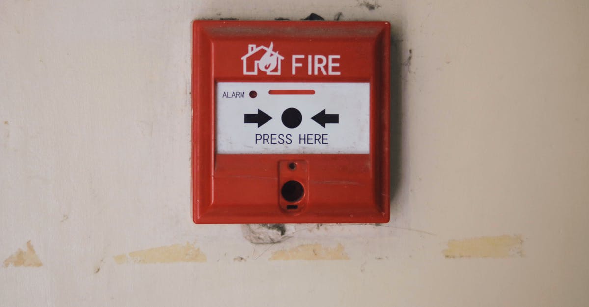 Which Hitman games feature manual save? - Emergency safety fire detection system box for safety with inscription and push button placed on white wall in light room