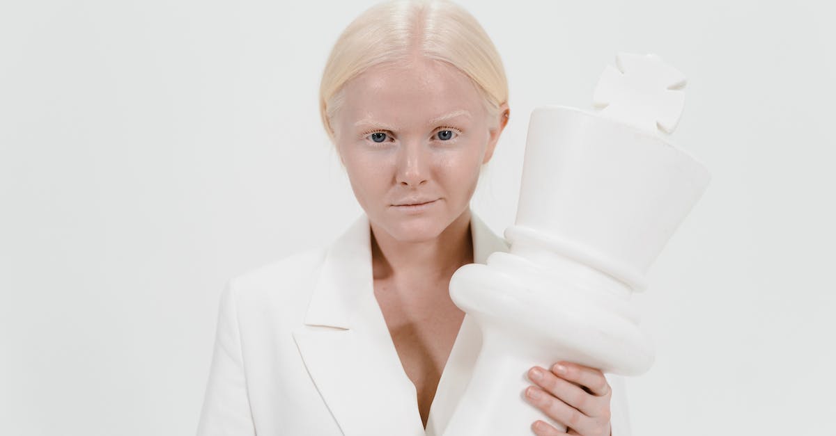 Which hold has the most giant camps? - A Woman Holding a White Giant Chess Piece