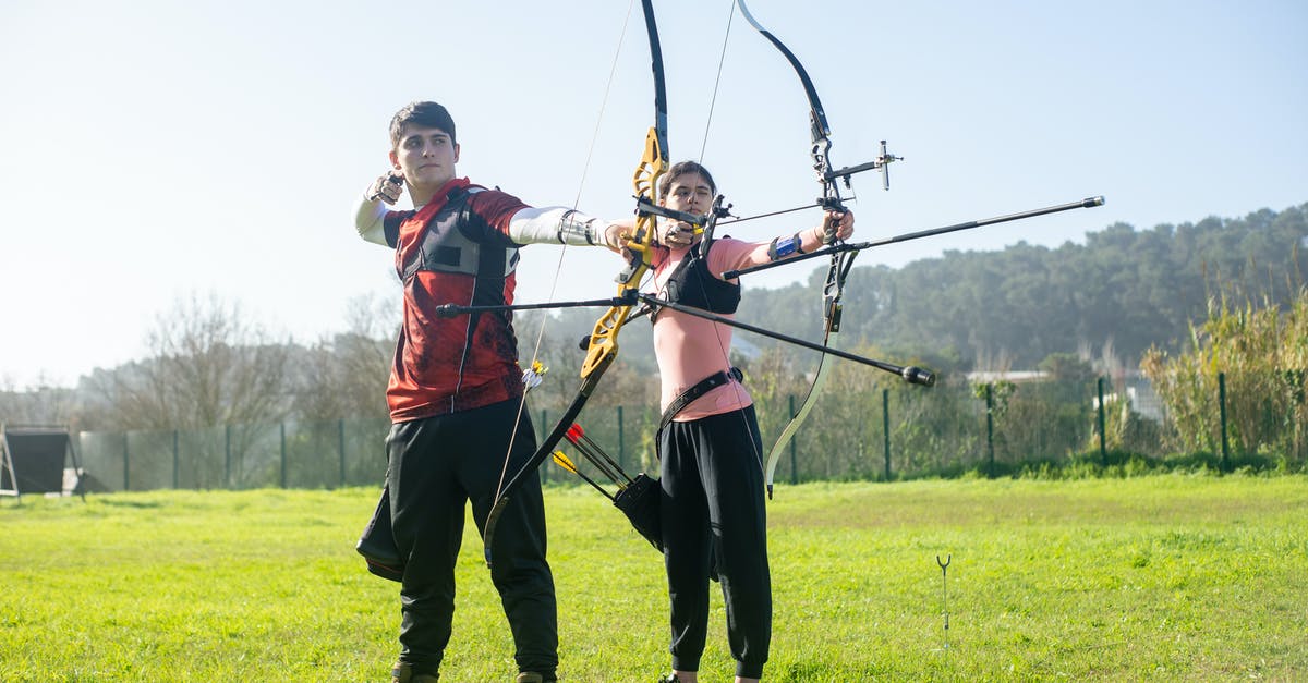 Which is the better archer? - Archers aiming at an Archery Target Which is the better archer? - Archers aiming at an Archery Target