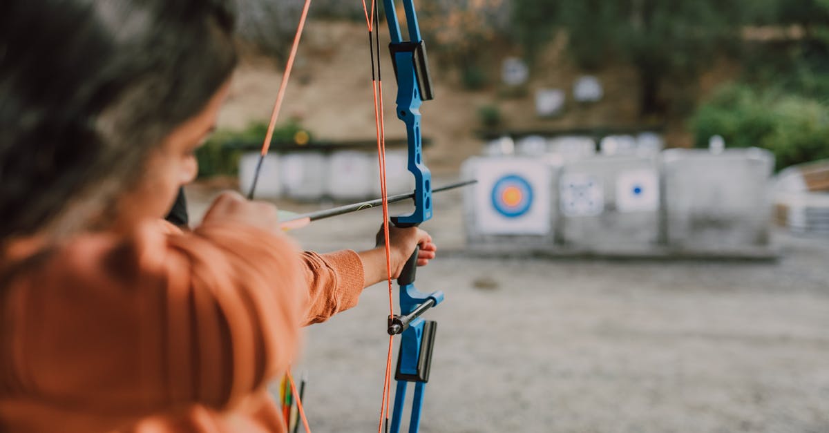 Which is the better archer? - A Person Holding an Archery Bow Which is the better archer? - A Person Holding an Archery Bow