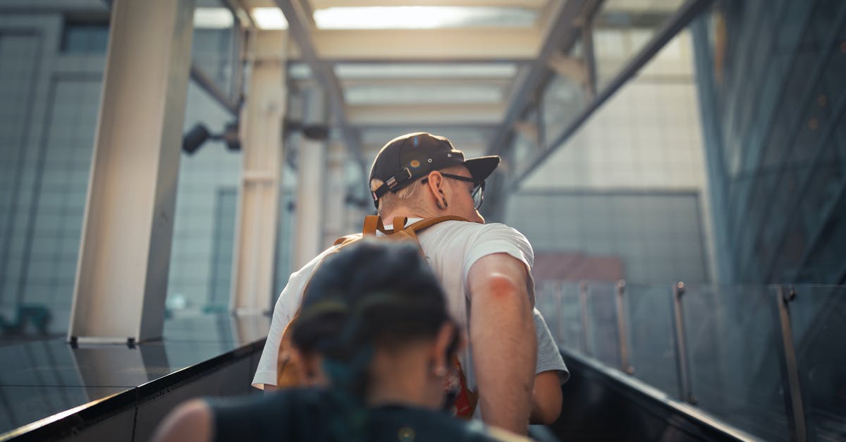 Which is the most efficient way to level up my TI5 compendium? [duplicate] - From below back view unrecognizable people in casual wear going up on outside escalator of modern building in daylight