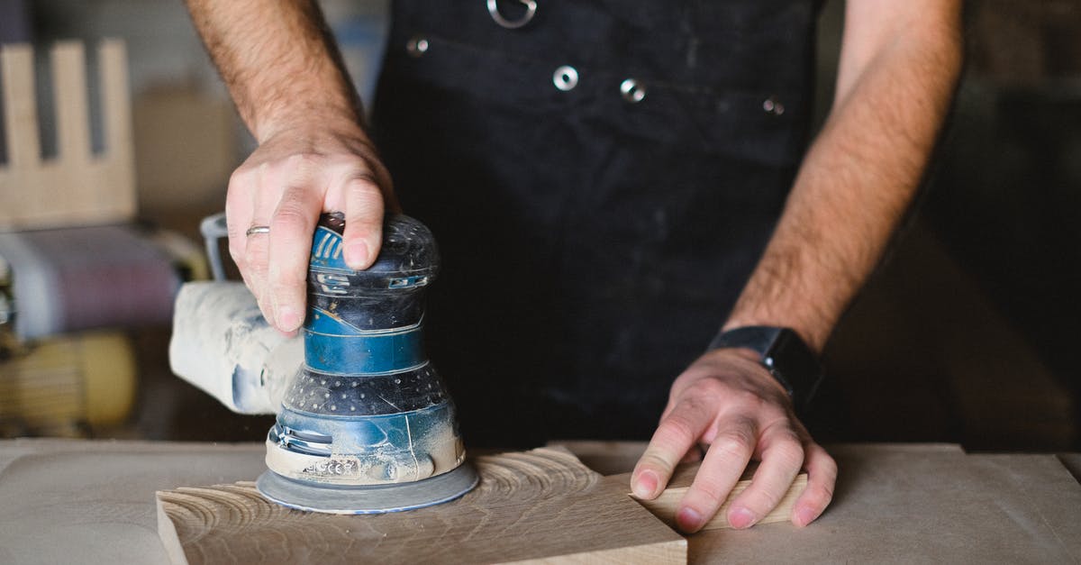 Which pieces of equipment have special uses (e.g. as crafting components)? - Unrecognizable male carpenter using random orbital sander while working with wooden detail at workbench in professional workshop  on blurred background