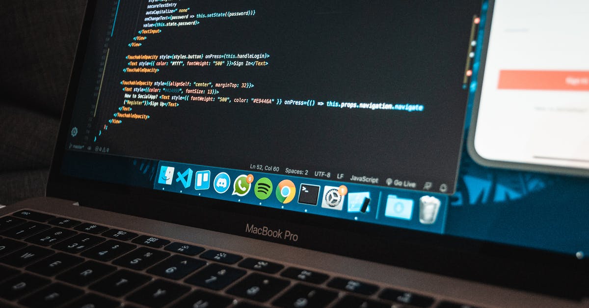 Which programming language is the Minceraft command system based off? - Workplace with modern laptop with program code on screen