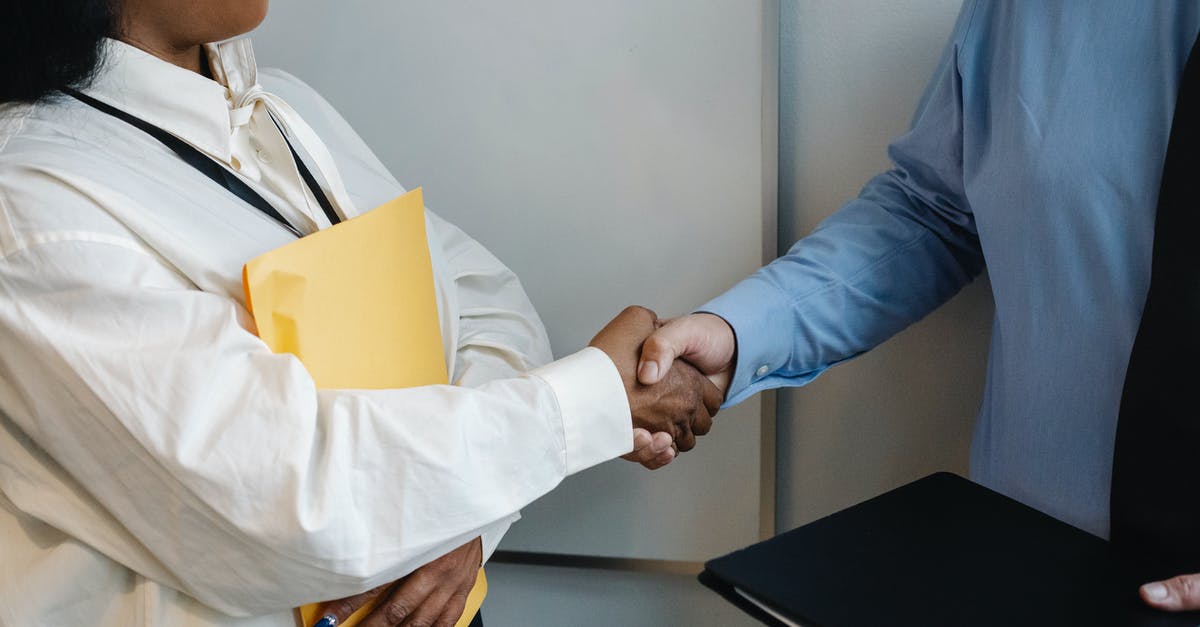 Which support conversations are missable? - Diverse coworkers shaking hands after meeting