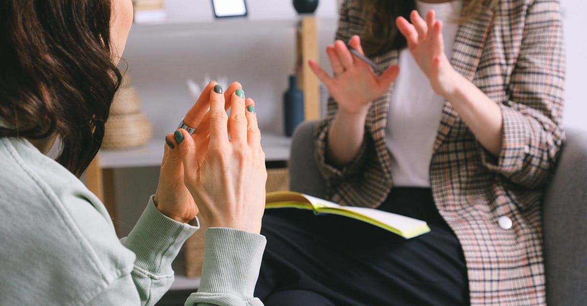 Which support conversations are missable? - Crop unrecognizable female psychologist and patient discussing mental problems during session Which support conversations are missable? - Crop unrecognizable female psychologist and patient discussing mental problems during session