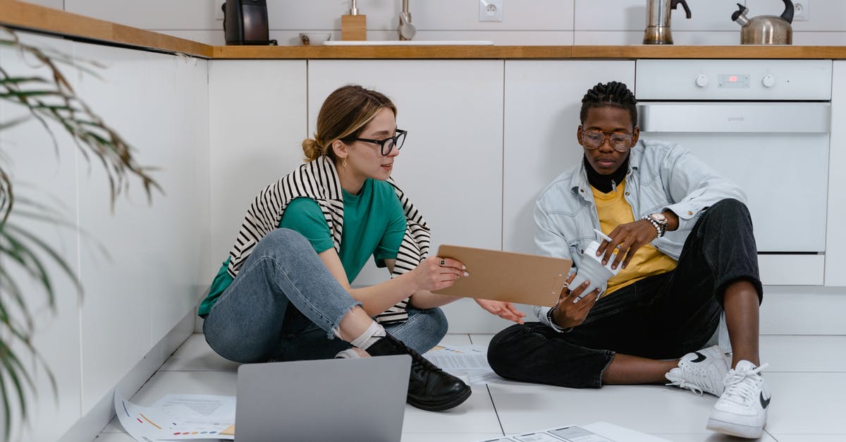 Which tasks are common tasks? - Man and Woman Sharing Ideas While Sitting on the Floor
