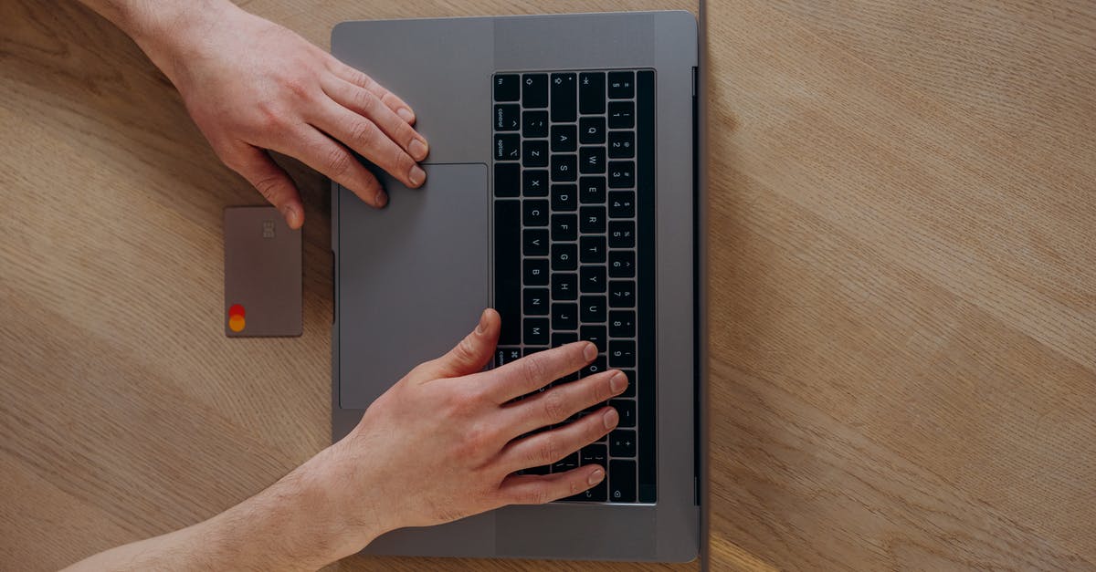 Which types of champions go top? - A Person Using a Laptop Beside a Credit Card on a Wooden Table Which types of champions go top? - A Person Using a Laptop Beside a Credit Card on a Wooden Table