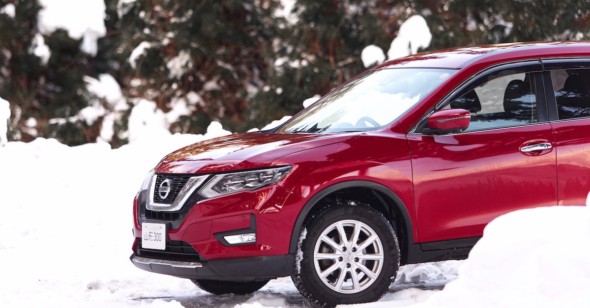 Which version of Rogue Galaxy (PS2) is the one that doesn't freeze? - 
A Parked Red Nissan Rogue during Winter