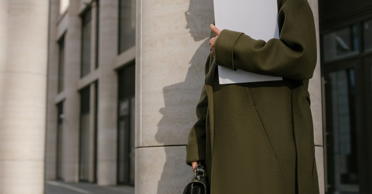Who Are The Highest Potential Players On Career Mode? - Person Standing Beside the Column Holding Papers and Briefcase